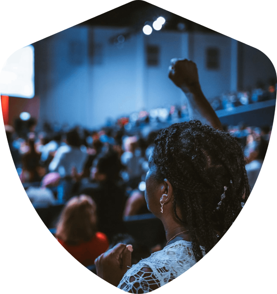 Woman raising her fist at a conference